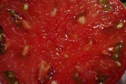 The beautiful meaty flesh of a Brandywine tomato