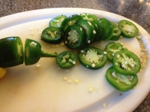 Make sure to wear protective gloves when cutting off the stems and slicing the hot peppers!