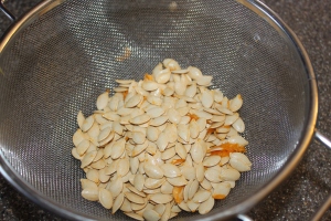 Put your seeds into a colander and you can wash them off and dry them for later use. 